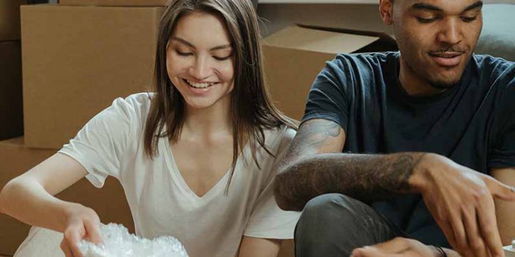 Couple packing up their kitchen items