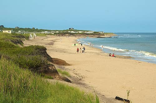 people walking on the beach in Montauk, NY
