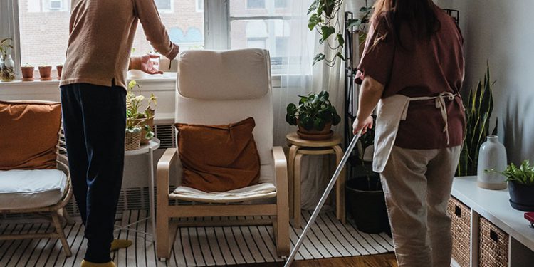 Couple cleaning their apartment