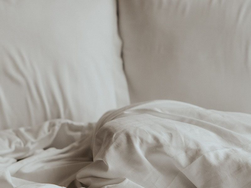 White pillows and sheet on bed