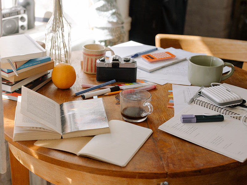 Table with a lot of clutter.
