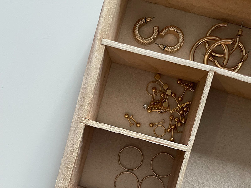 Gold jewelry in jewelry box.