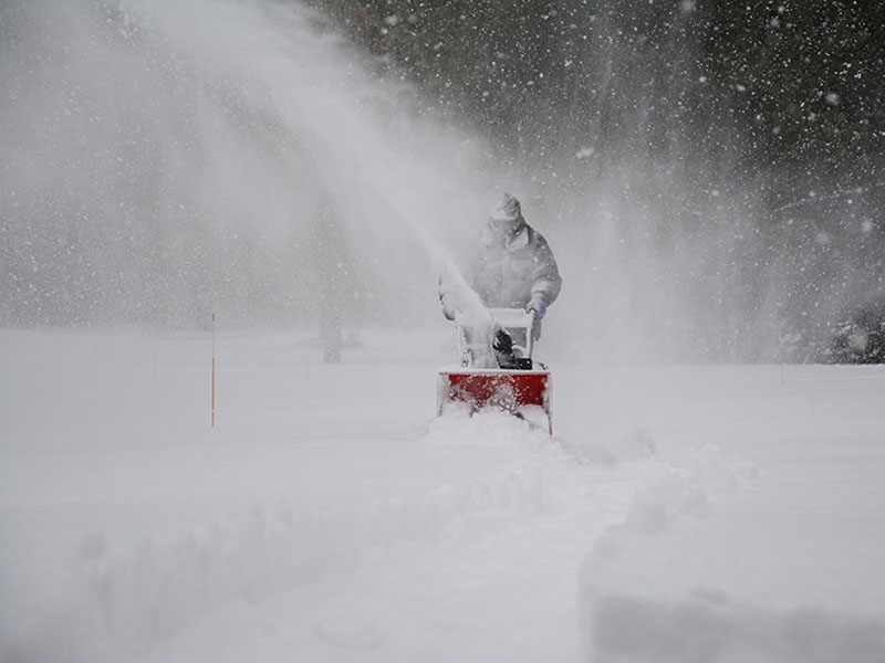 Snow removal with a snowblower.