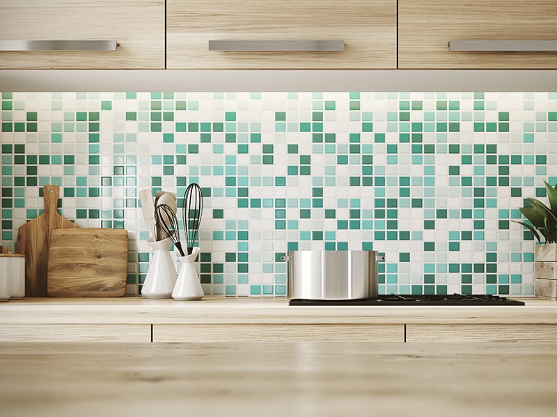 green tiled kitchen backsplash