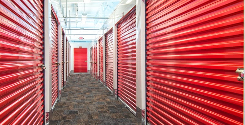 hallway of red storage doors
