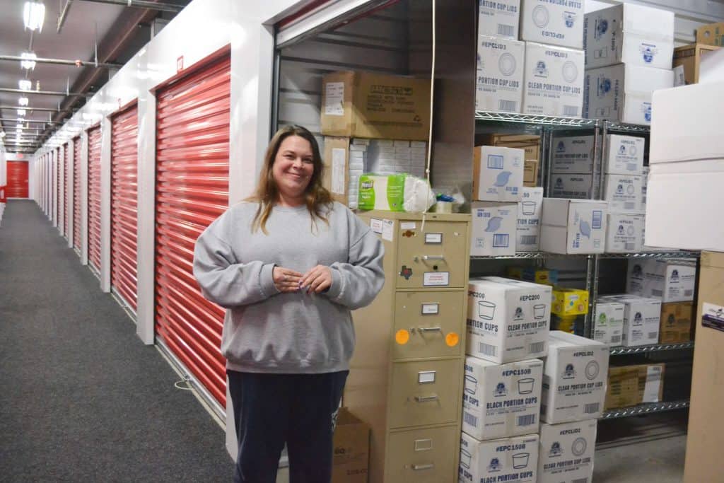 Candice Garcia standing in front of her storage unit
