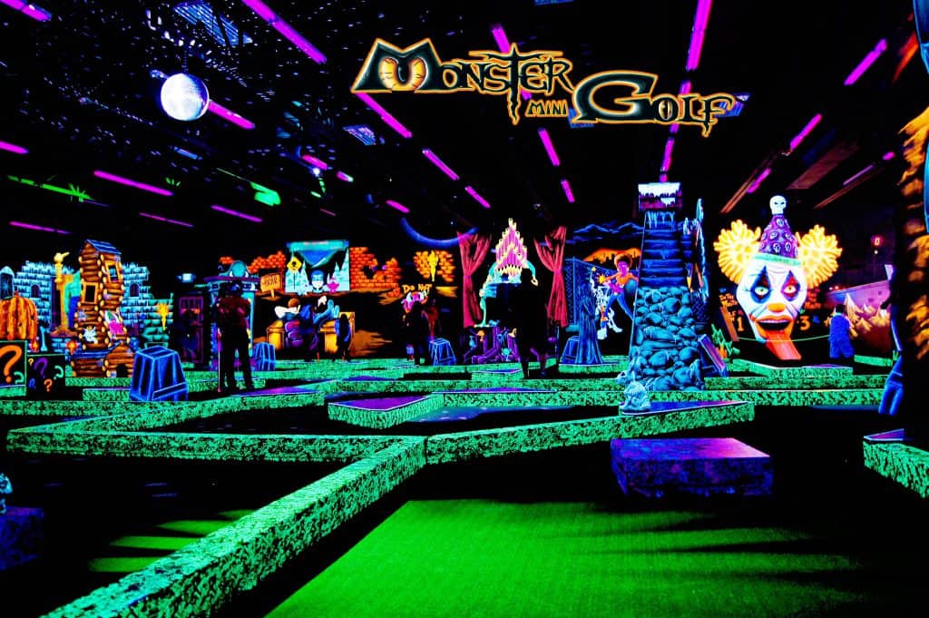 Monster City golf, a backlit mini golf course with neon paint
