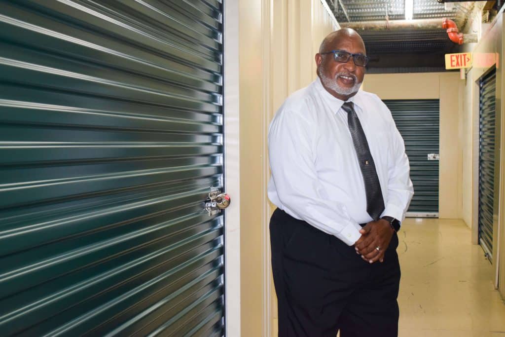 Ron Carter standing next to his storage unit