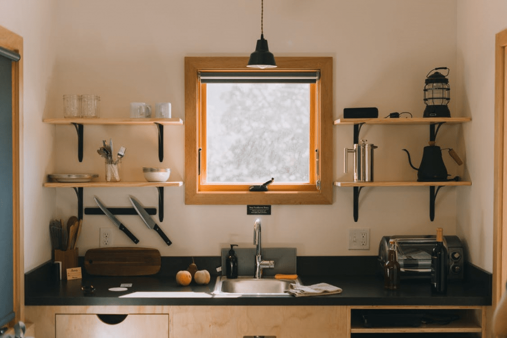 Small kitchen with wall shelving