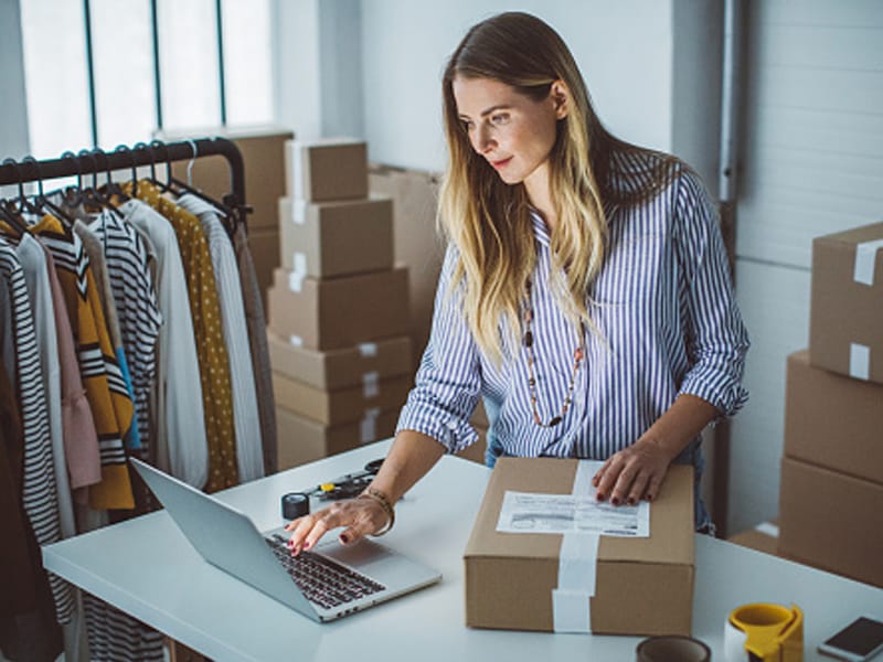 small business owner white woman with boxes