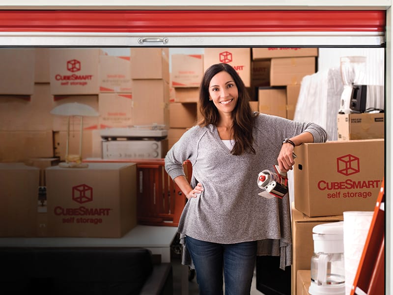 woman in packed storage unit