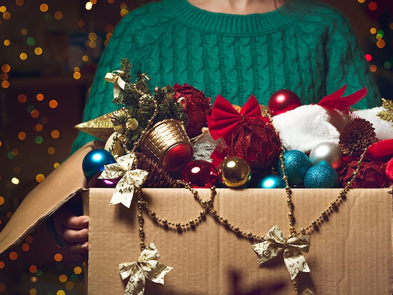 Cardboard box full of xmas tree decorations
