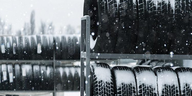 tires on rack snowing