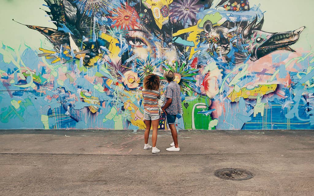 Couple looking at wall art at the Wyndwood Art Walk, Miami, Florida