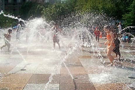 children running through fountains in Houston, Texas