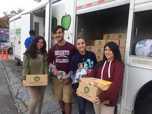 young adults volunteering at the Houston Food Bank