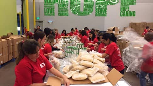 volunteers helping pack food at the Houston Food Bank