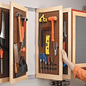 tools hanging on pegboard panels