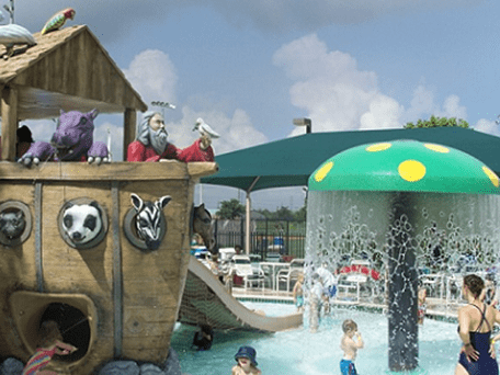 Children playing at Noah's Arc pool playground area in Houston, Texas