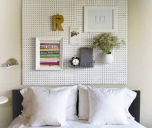 items hanging on a pegboard headboard