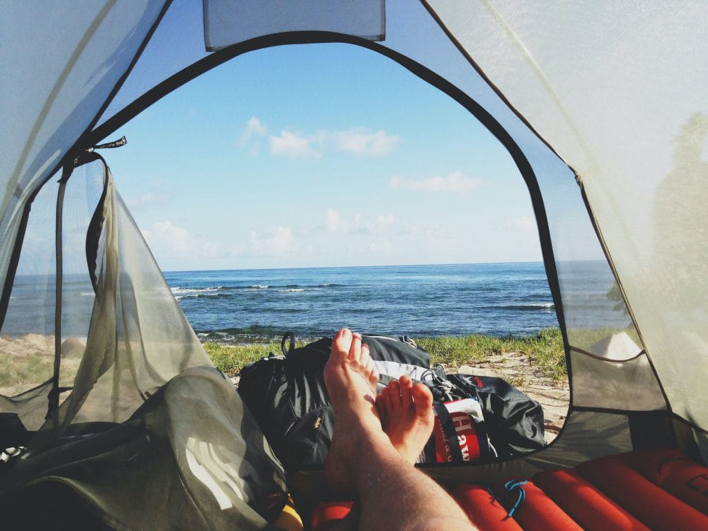 ocean view from tent with feet