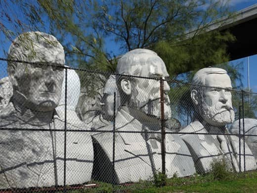 three sculptures of president's heads in Houston