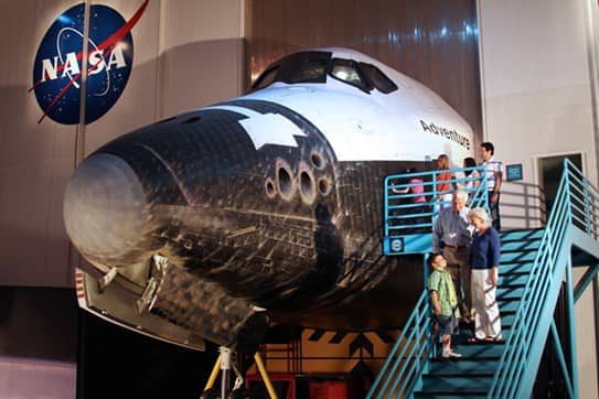 people visiting a replica of a space craft at NASA in Houston
