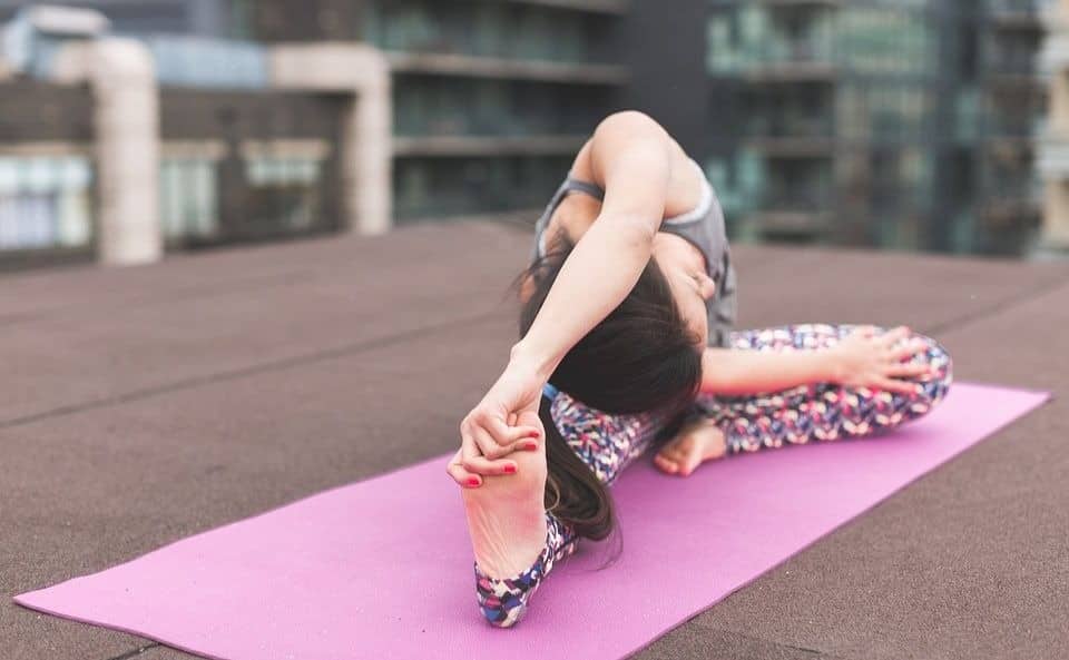 Woman using yoga mat for exercise