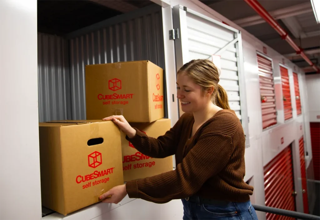 Woman loading mini storage uni